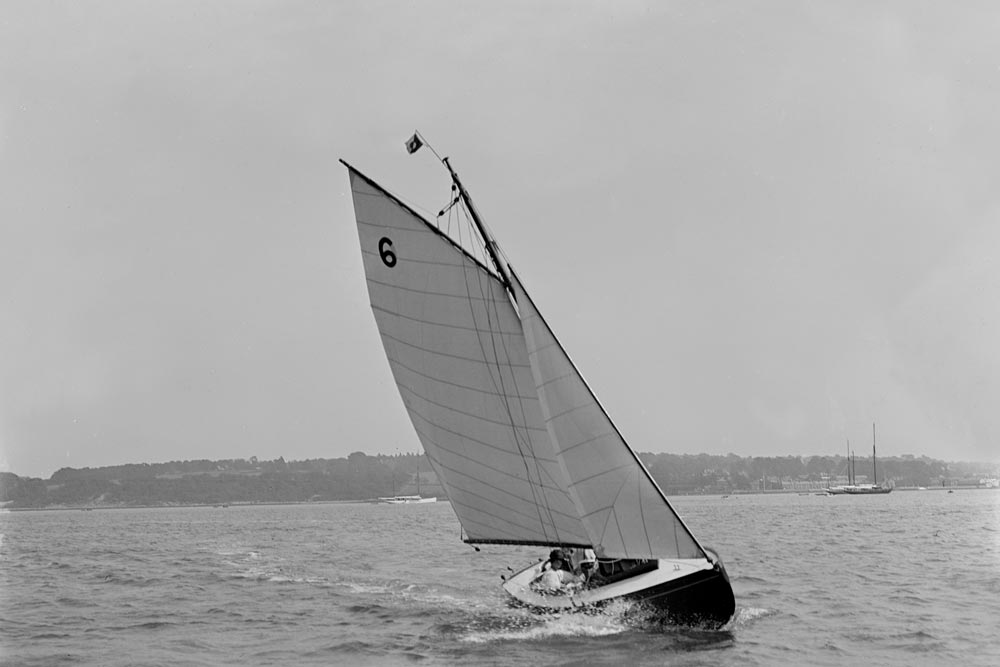 The sloop 'Genista' under sail on the River Hamble, 1920. Creator: Kirk & Sons of Cowes.