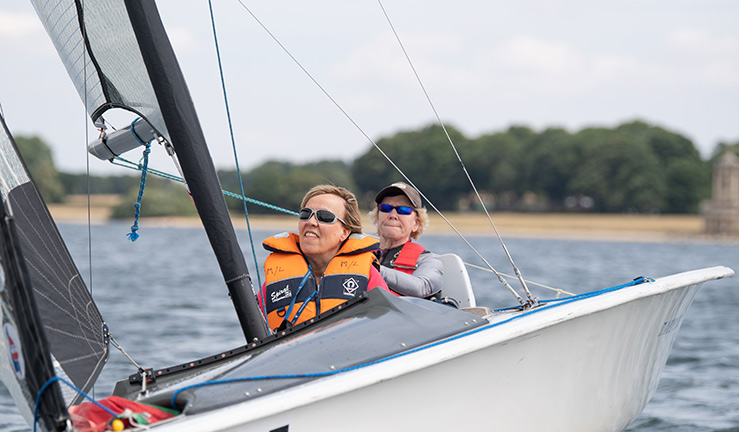 mid shot of a sailor/sailors on a lake