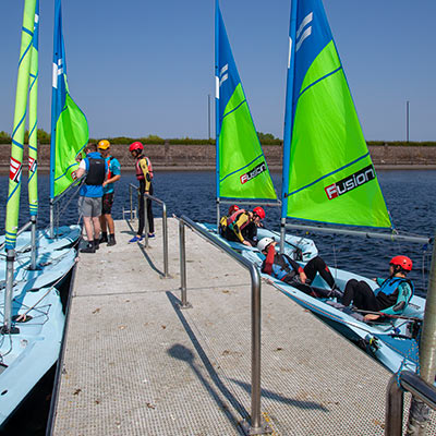 a group of kids out on the water