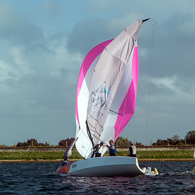 keel boat with open sailing on a lake 