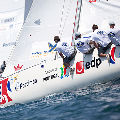 A keelboat competing in a match race