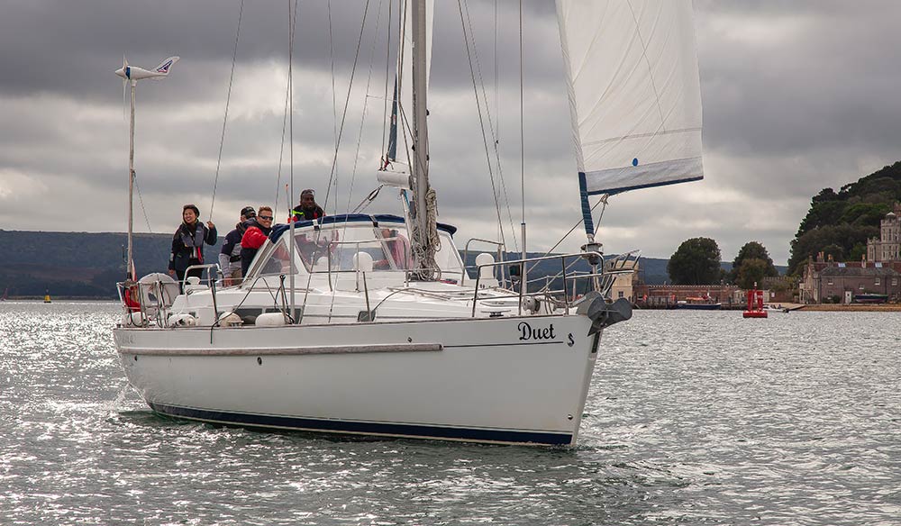 Wide shot of boat with sailors