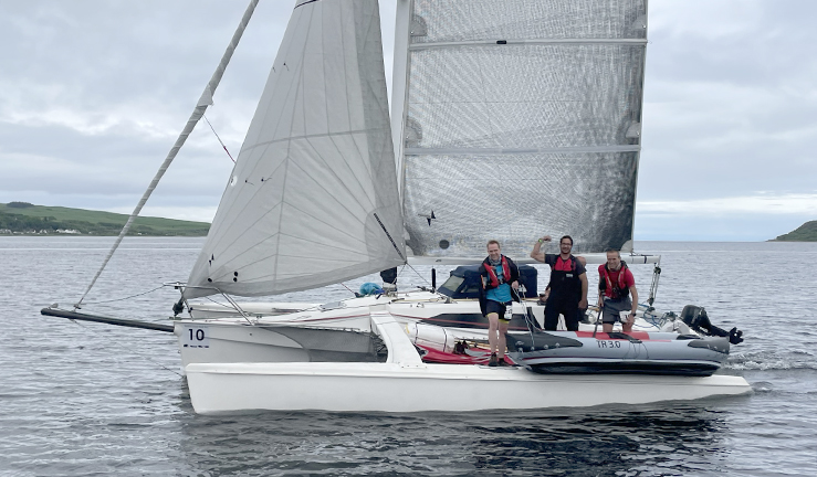 Participants in the 3 peaks race, with fell runners onboard keelboats. 